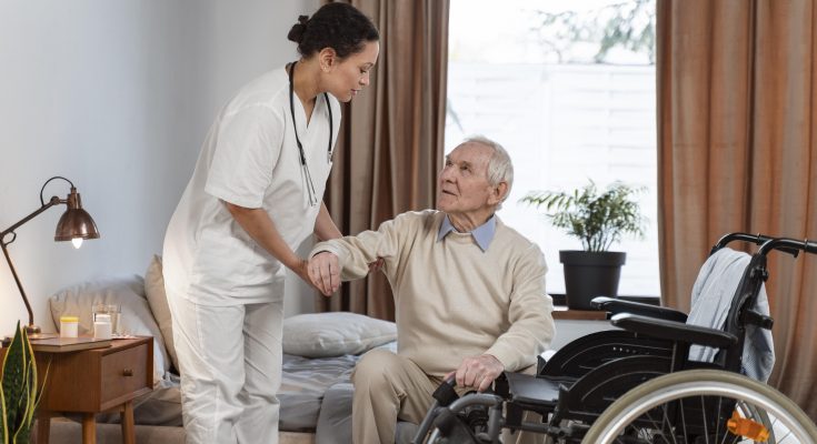Doctor reviewing hospital software options on laptop