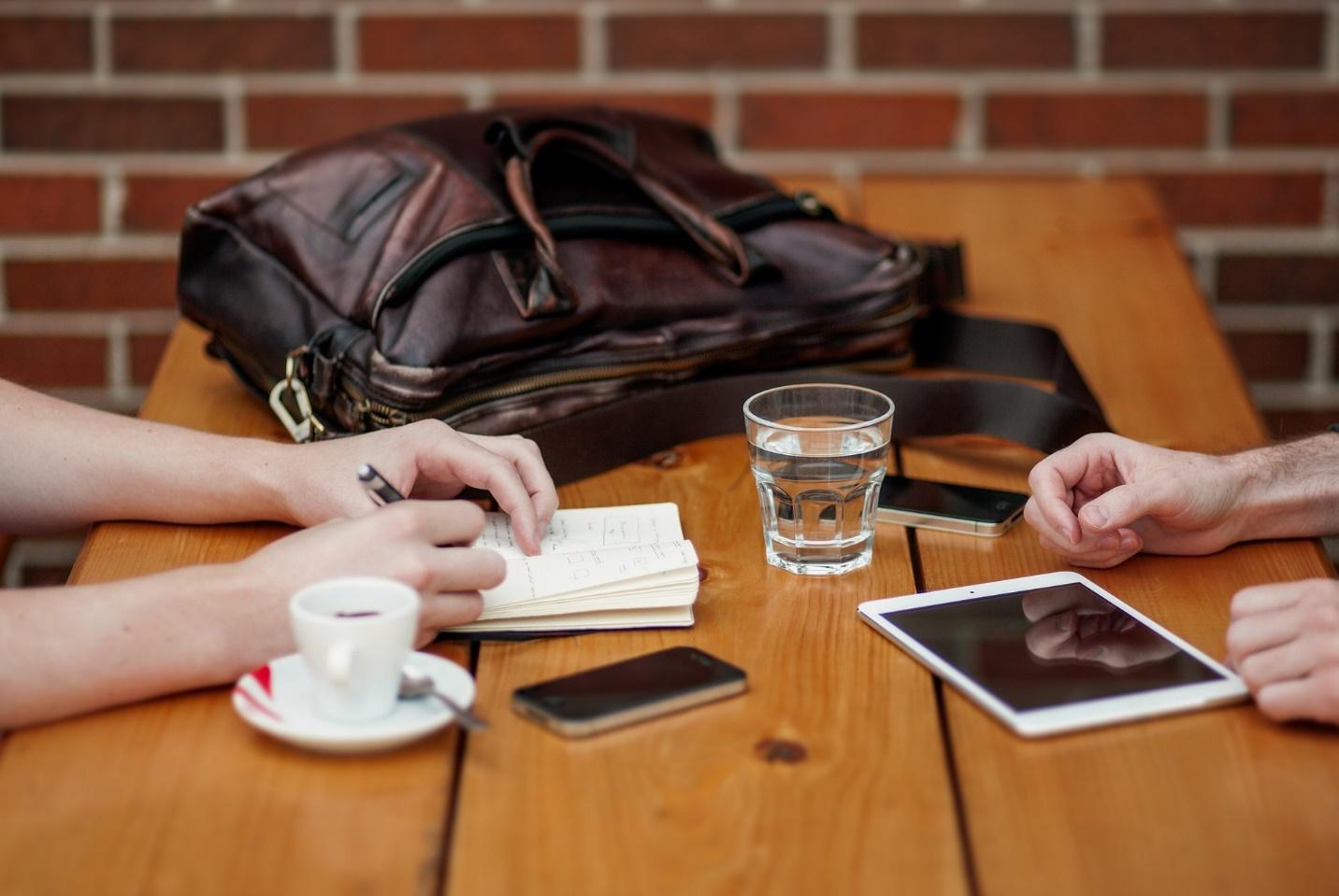 Salesperson reviewing product presentation materials before a client visit | OneCity blog