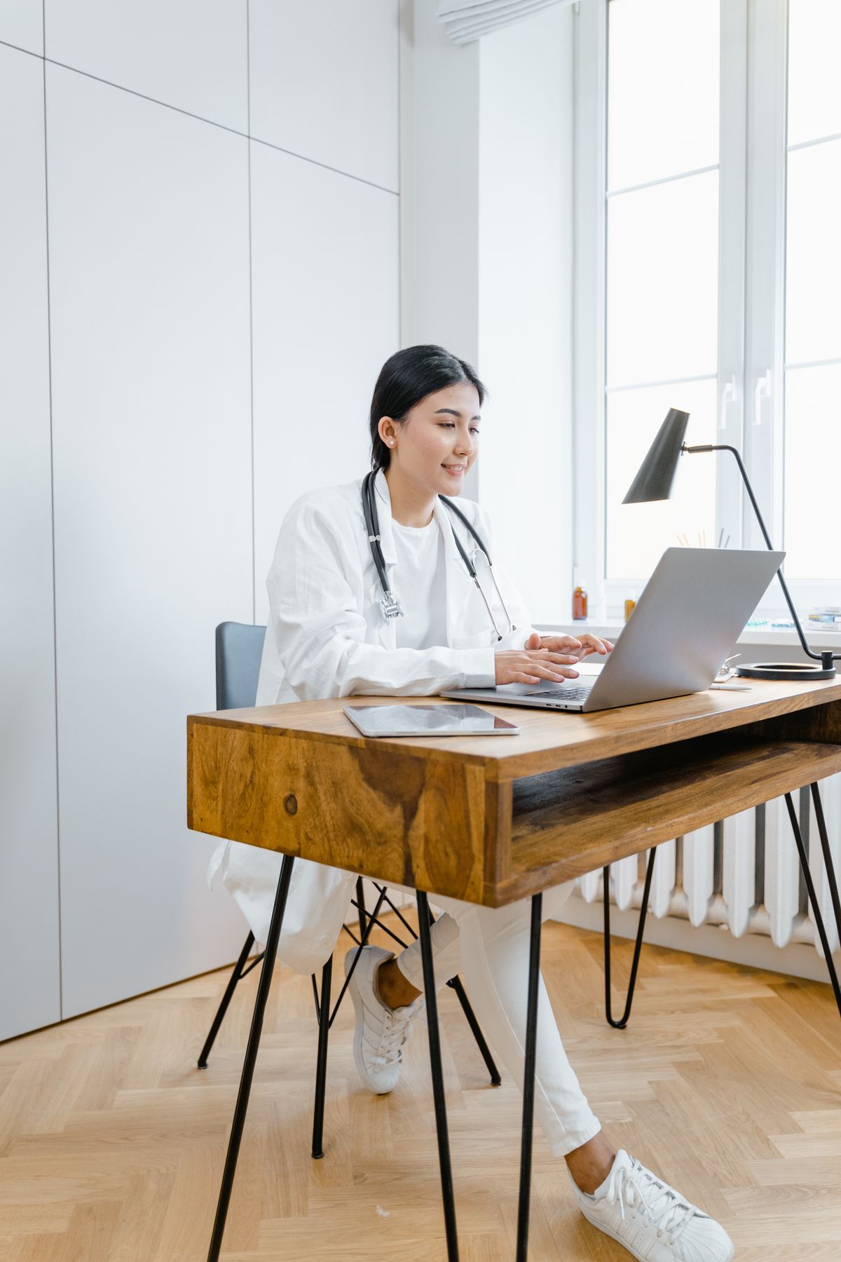 Doctor using a laptop for an online consultation representing digital healthcare