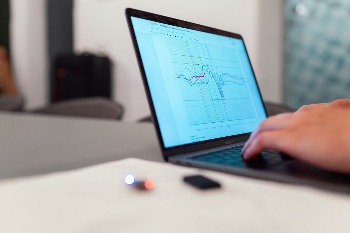 Person analyzing search data and graphs for keyword research