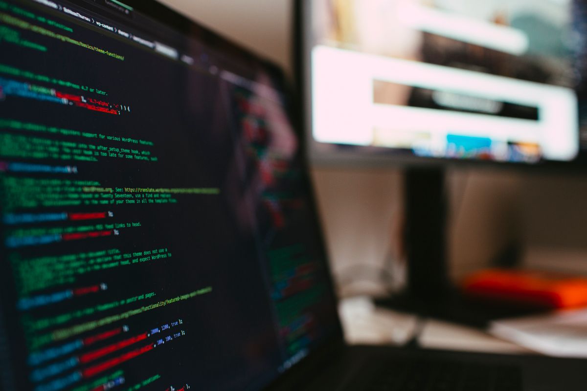 Laptop screen showing programming code representing WordPress website development